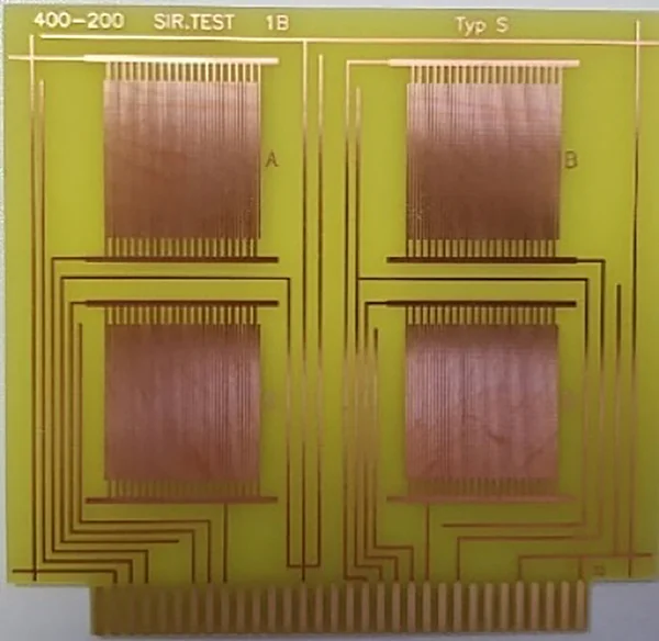 The picture shows a prepared test board: Four test structures are applied to a copper circuit board.