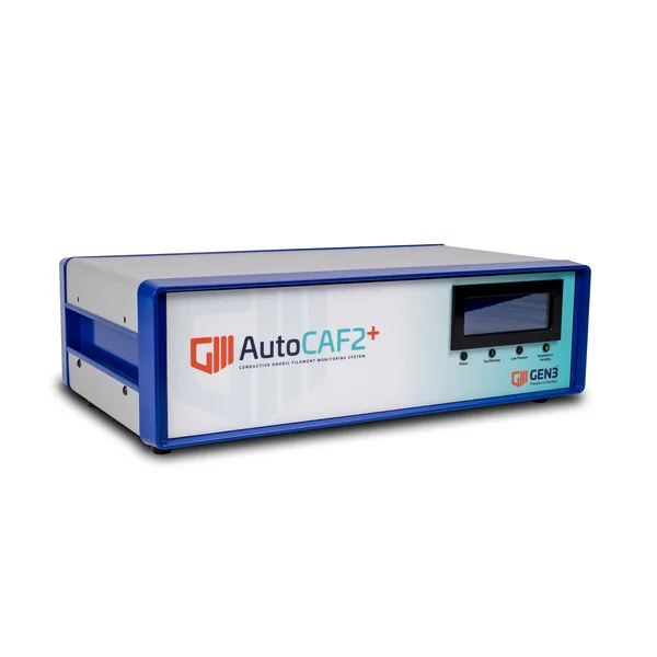 The picture shows the AutoCAF2+ device from GEN3 Systems, a rectangular light grey box with a display at the top right of the front.